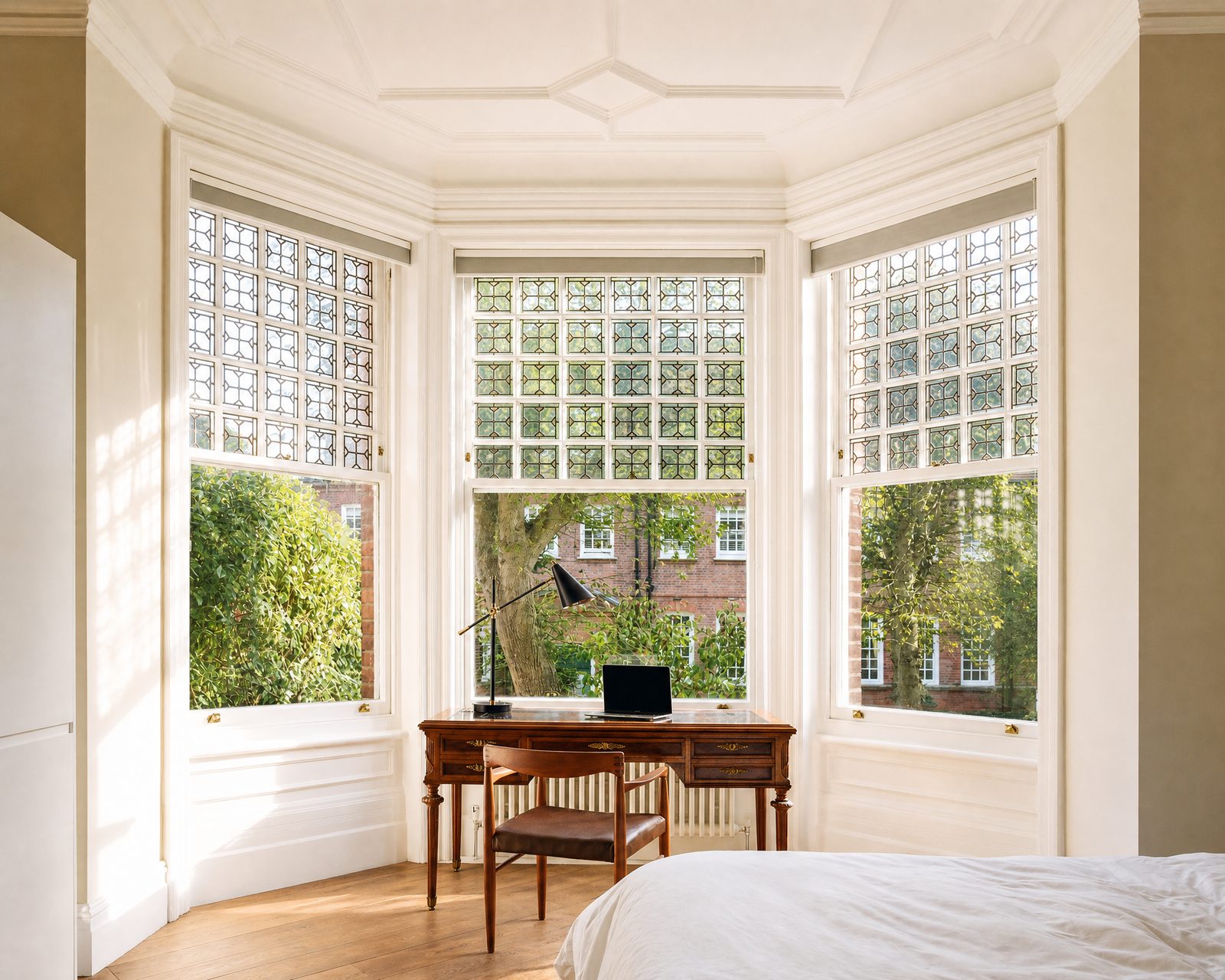 Bay of sash windows with leaded toplights